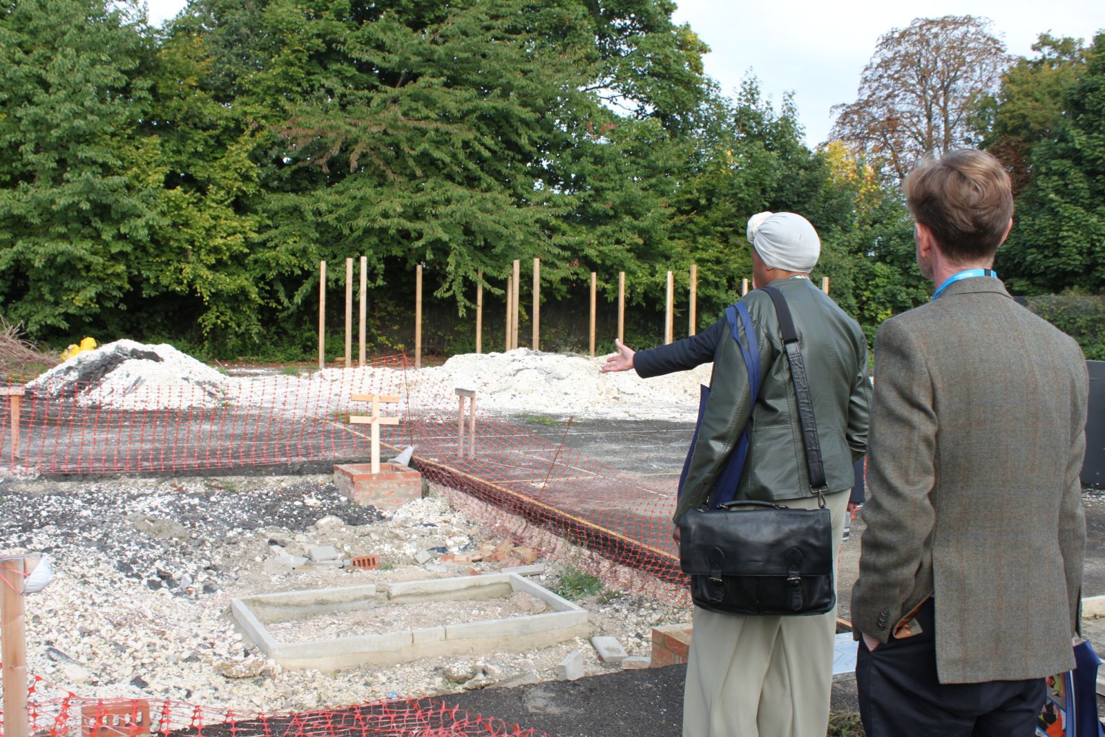 Visitors look at groundworks project