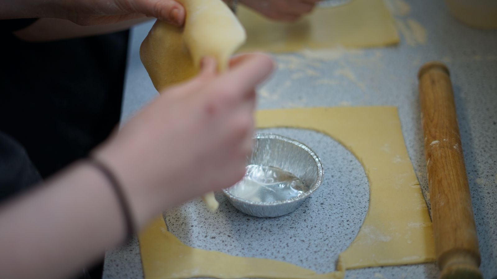 Student cutting pastry