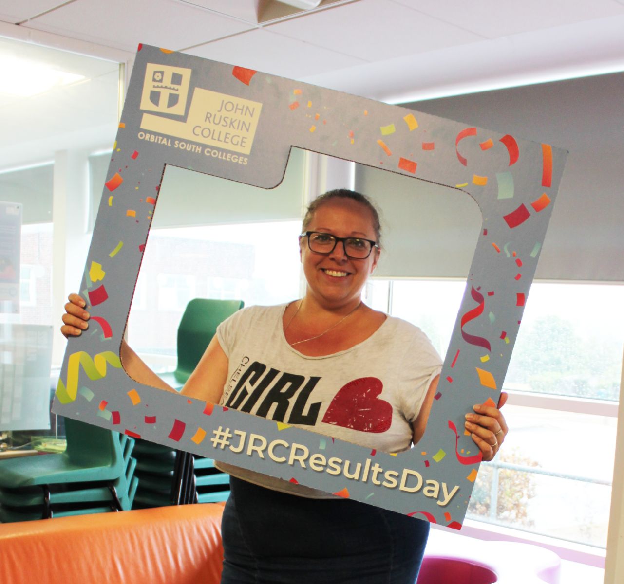 Student holding selfie frame to celebrate results day