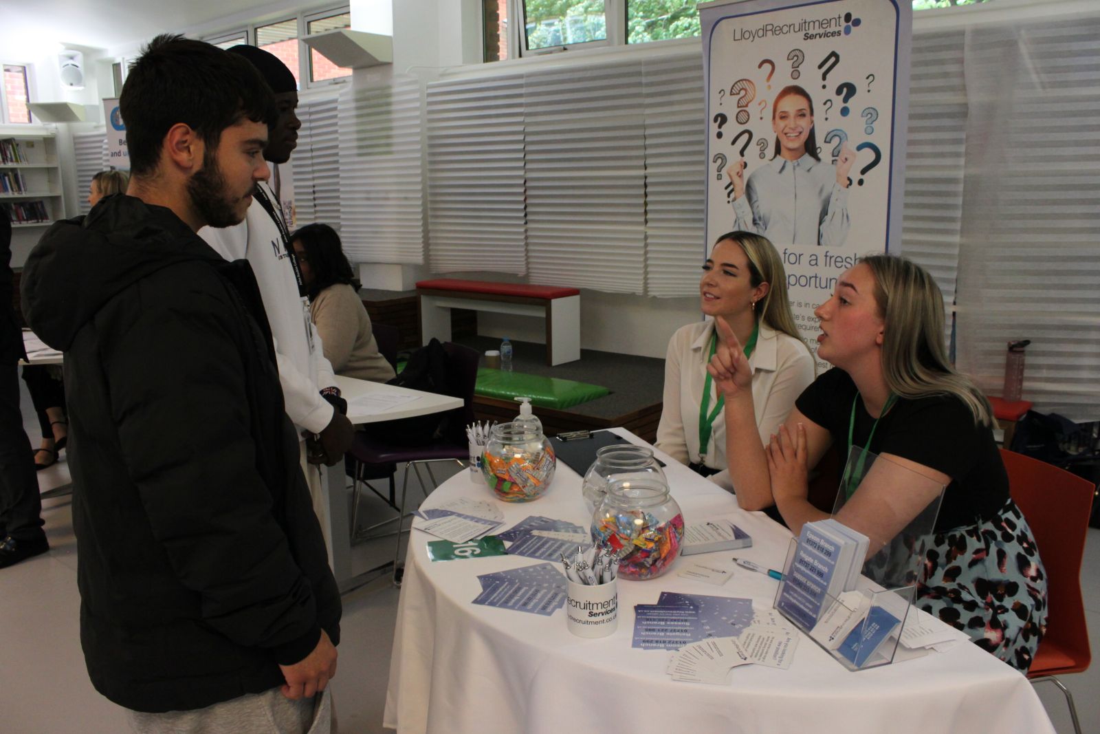 students talking to employers at careers fair