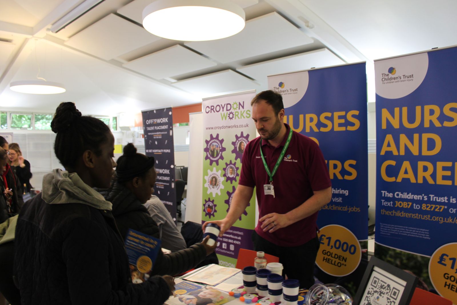 Employer talking to student at careers fair