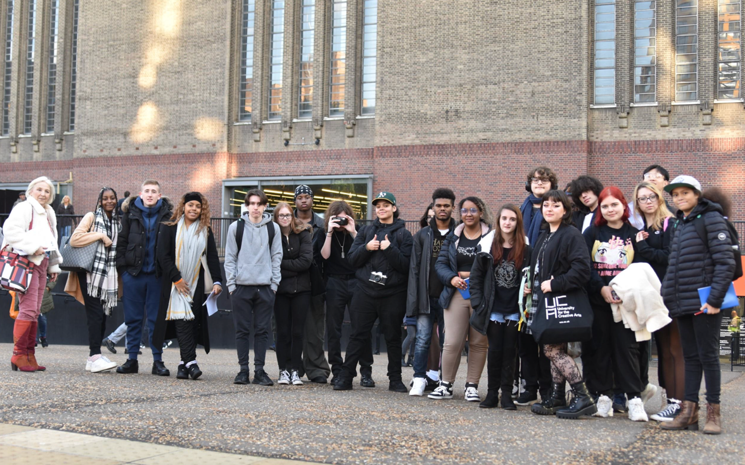 A large group of students outside the Tate Modern